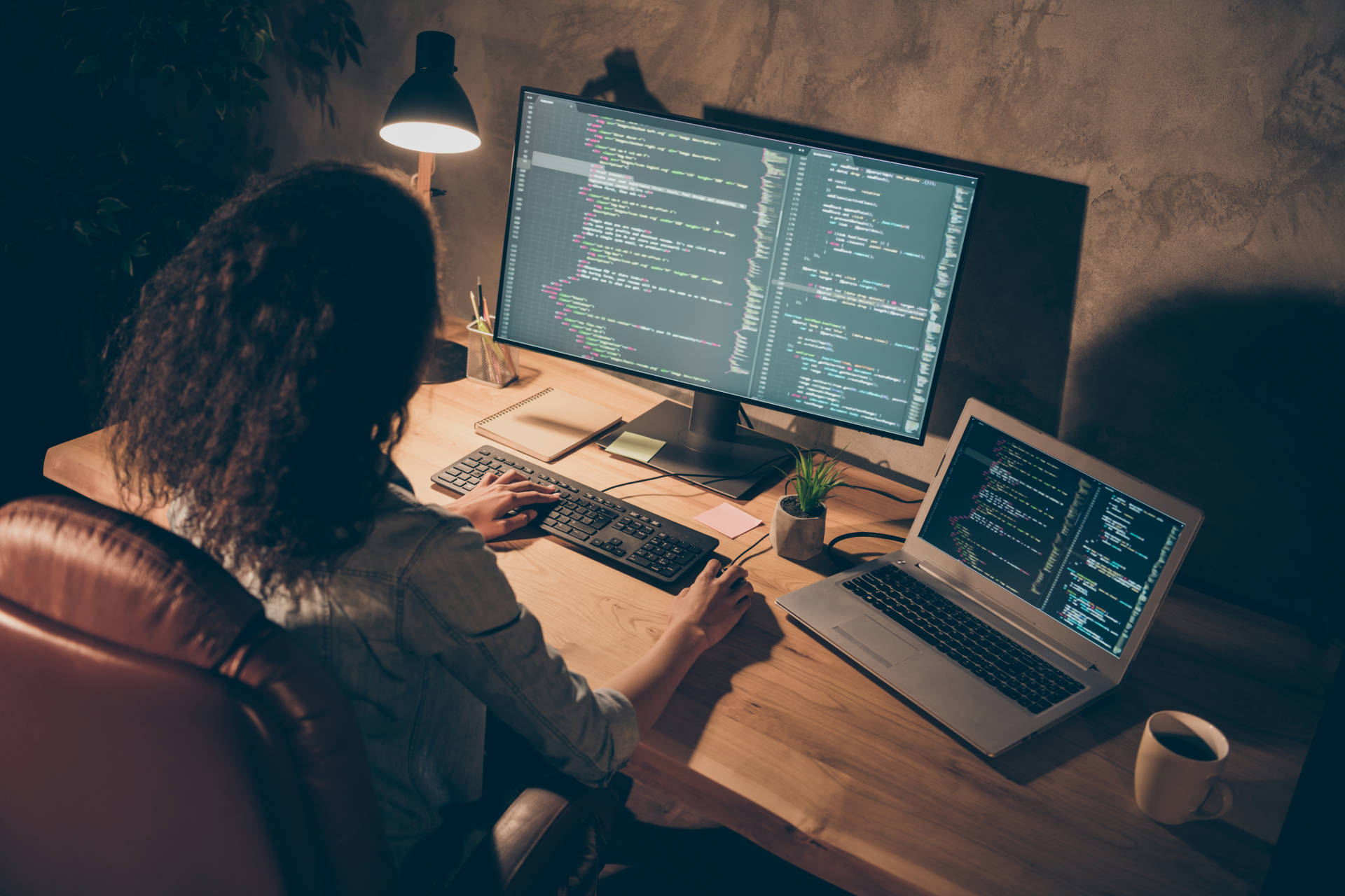 Woman coding at her home office